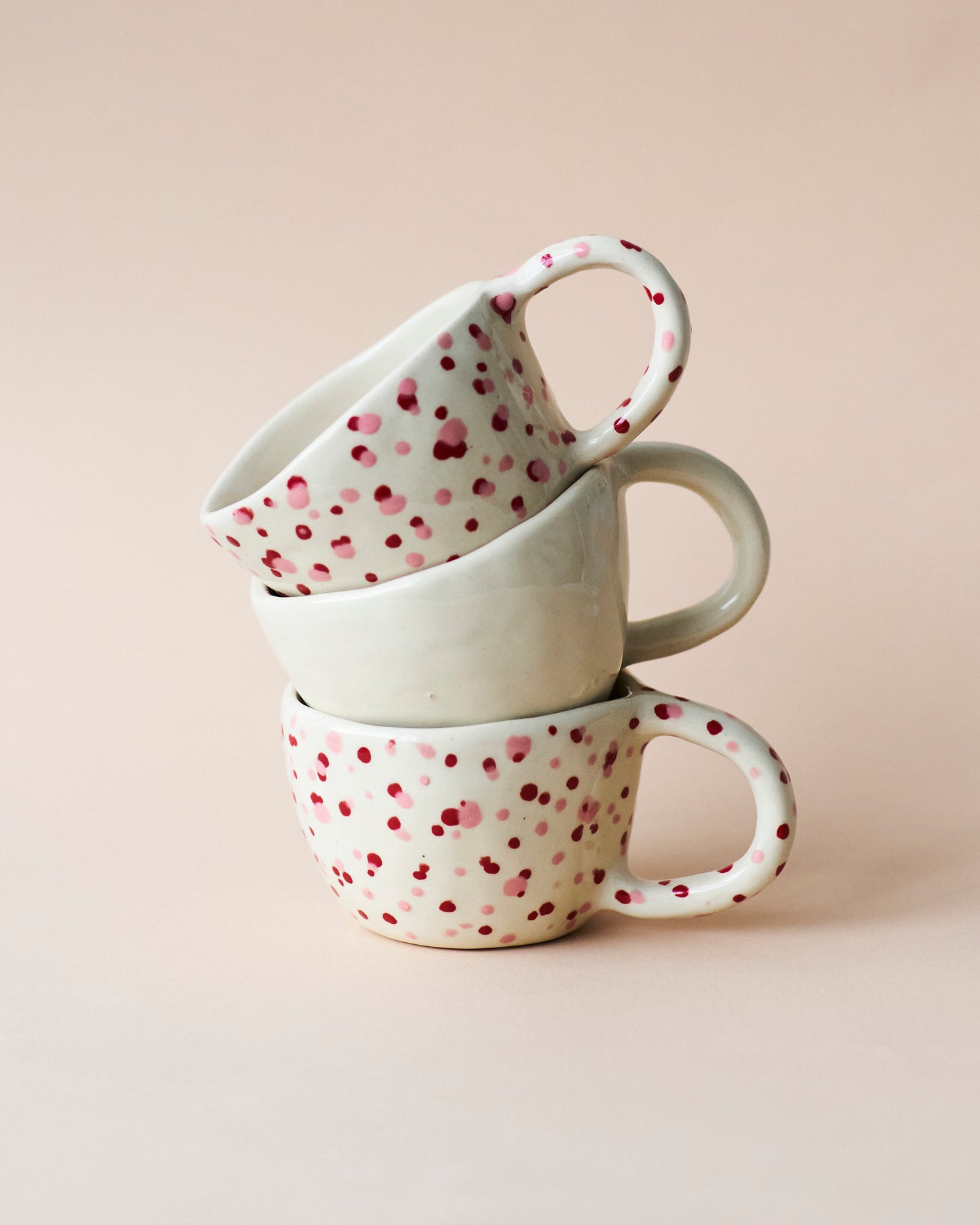 Handmade mushroom coffee cup with a cute red polka dot design, great for sipping matcha, chai, and reishi-infused latte.