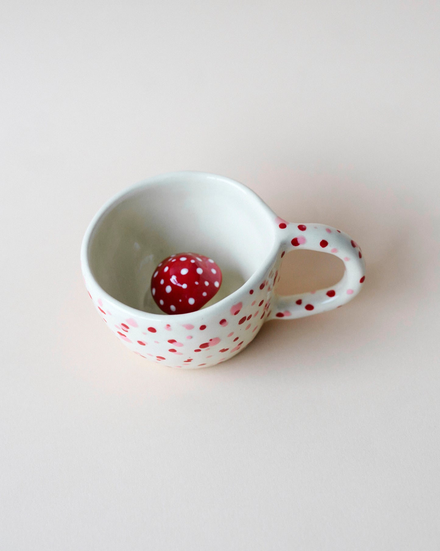 Handcrafted mushroom tea cup with polka dots, inspired by the Fly Agaric mushroom, great for reishi and adaptogenic coffee blends.